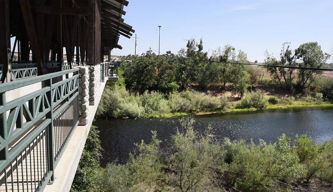 The Tuolumne River flows under the covered bridge in Roberts Ferry, Calif., on Tuesday, May 24, 2022.
