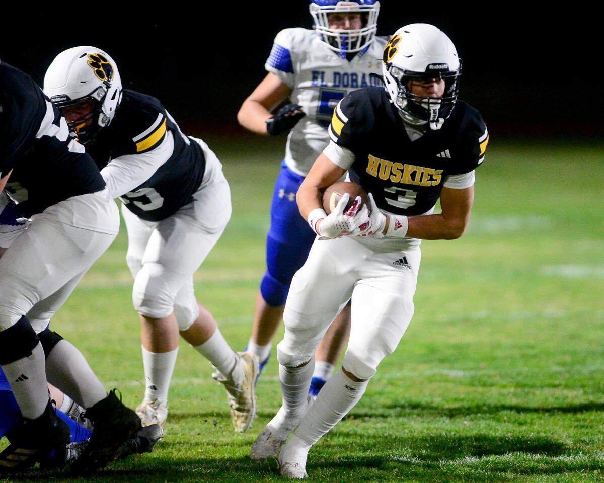 Hughson running back Lawson Aviles (3) finds a gap on a run during a 2024 CIF Sac-Joaquin Section Division V Playoff game between Hughson High School and El Dorado High School at Hughson High School in Hughson California on November 15, 2024. Hughson won the game 28-6.