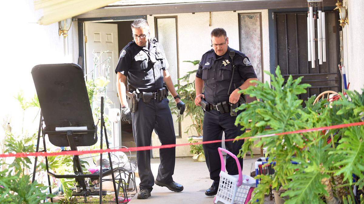 Modesto police investigate at the scene of a shooting on Longbridge Drive, just north of Standiford Avenue between Tully and Carver roads.  A Modesto man faces a charge of attempted murder in the shooting of his girlfriend Thursday afternoon in Modesto.