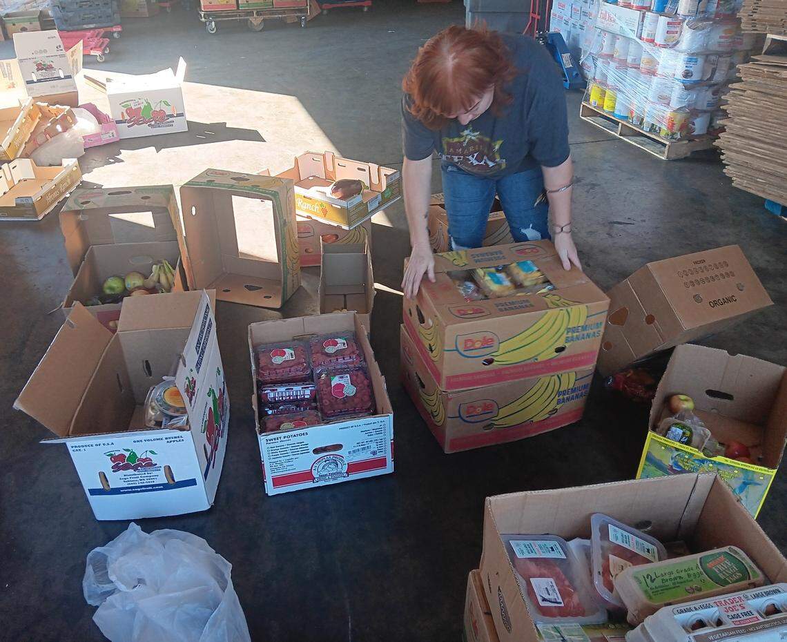 The Food Initiative of Greater Stanislaus, formerly Inter-Faith Ministries of Greater Modesto, is going mobile with its food pantry to eventually have its trucks make 42 stops each month in locations across the county, including Modesto, Oakdale, Turlock, Waterford and Patterson. Here, Food Initiative employee Sonia Sone Martinez sorts food donated by Trader Joe’s on Thursday, Oct. 5, 2023, in the Food Initiative warehouse.