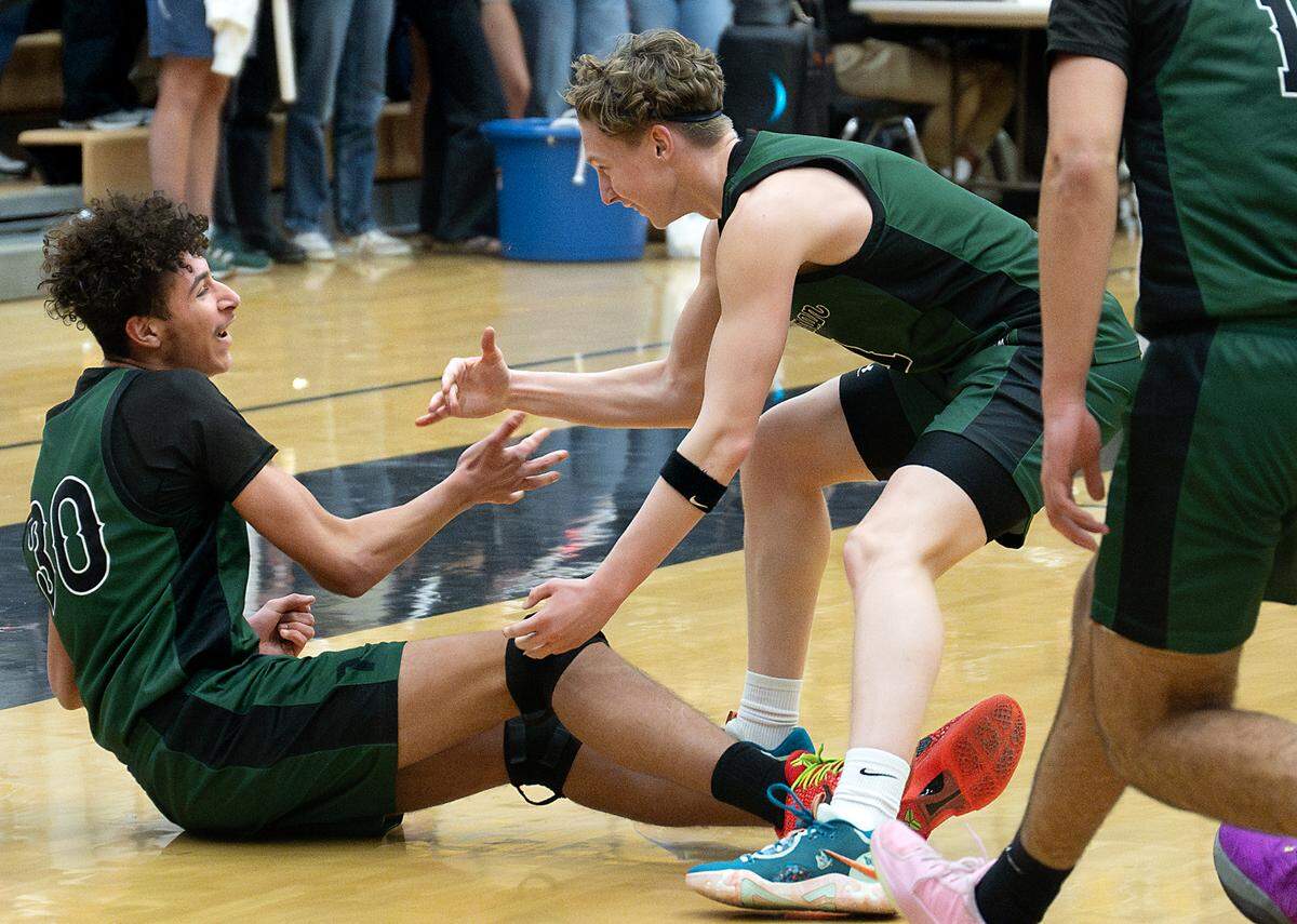 Pitman’s Avery Sanchez, right, and Isaac Dorsey celebrate Dorsey’s three point basket during the Central California Athletic League game with Enochs at Enochs High School in Modesto, Friday, Jan. 24, 2025.