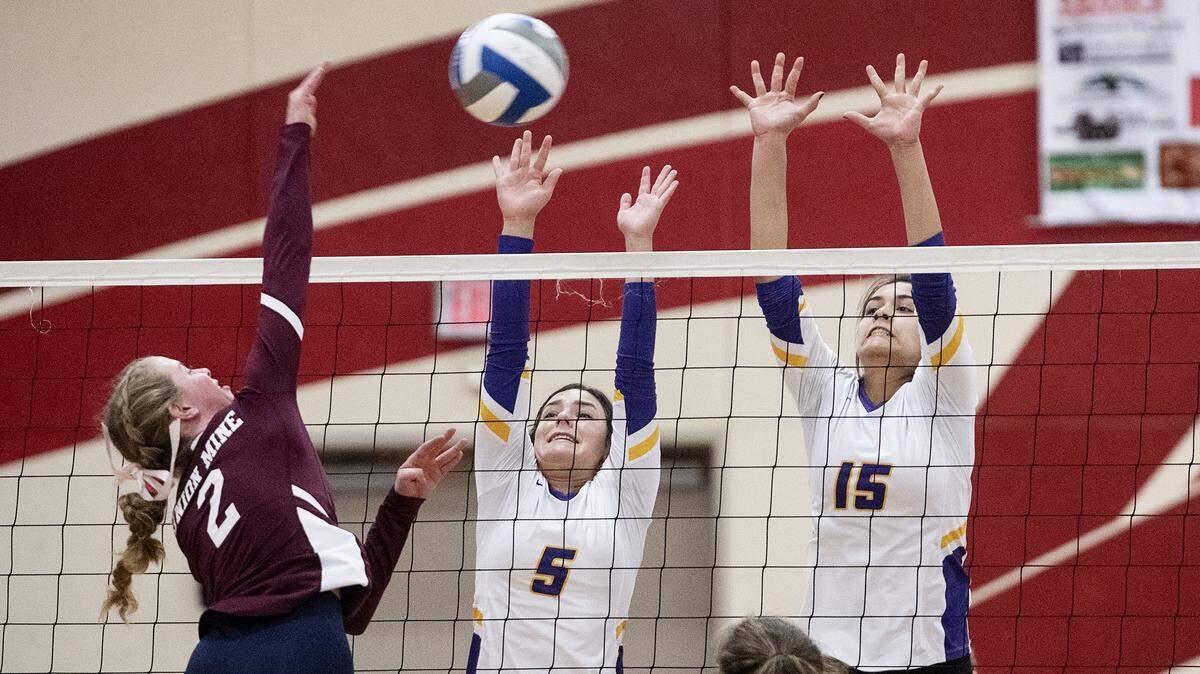 Escalon’s Hannah Boyd (5) and Melanie Smith (15) defend against Union Mine’s Mikayla Ide during the Division IV Championship at Ripon High School in Ripon, Calif., Saturday, Nov. 9, 2019. Escalon won the match 3-2.