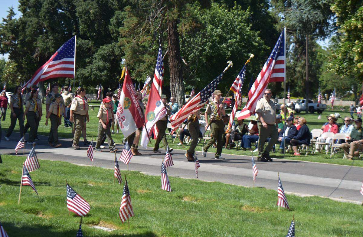 Scouts of Troop 1920 of St. Joseph’s Catholic Church carry the colors at the 2026 Memorial Day observance at Acacia Memorial Park in Modesto on Monday, May 25.
