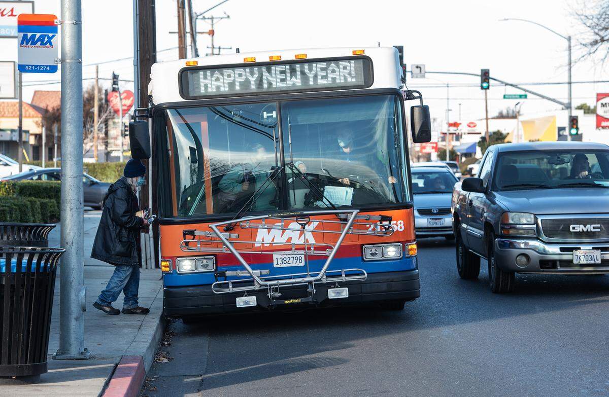 Modesto Area Express bus picks up passengers on McHenry Avenue in Modesto, Calif., Tuesday, Dec. 5, 2021.