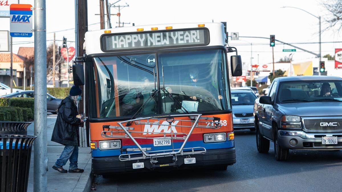 Modesto Area Express bus picks up passengers on McHenry Avenue in Modesto, Calif., Tuesday, Dec. 5, 2021.
