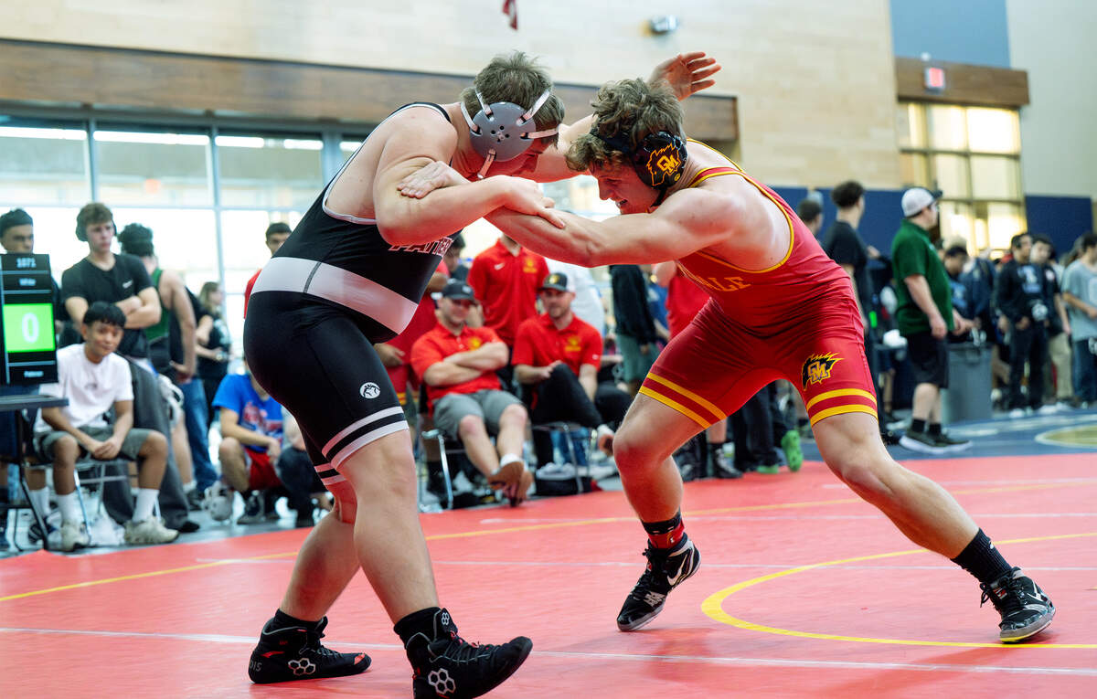 Oakdale’s Wes Burford, right, challenges Randy White of Patterson in the 217-pound semifinal match in the Valley Oak League Championships at Central Catholic High School in Modesto, Friday, Feb. 6, 2026. Burford later claimed first place with win over Michael Smith of Manteca.