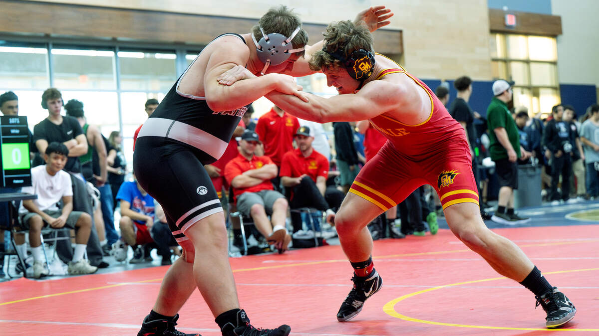 Oakdale’s Wes Burford, right, challenges Randy White of Patterson in the 217-pound semifinal match in the Valley Oak League Championships at Central Catholic High School in Modesto, Friday, Feb. 6, 2026. Burford later claimed first place with win over Michael Smith of Manteca.