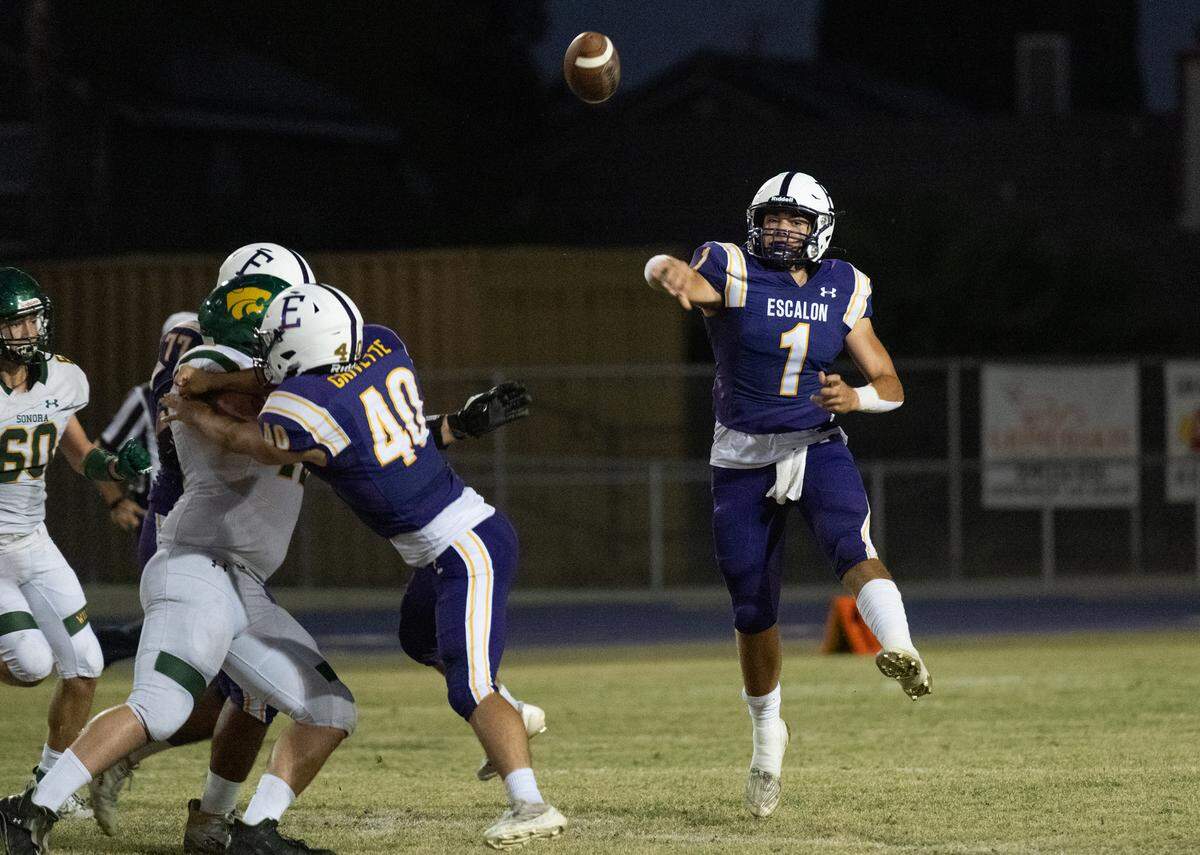 Escalon quarterback Logan Huebner makes a pass during the Trans Valley League game with Sonora at Escalon High School in Escalon, Calif., Friday, Sept. 20, 2024. 