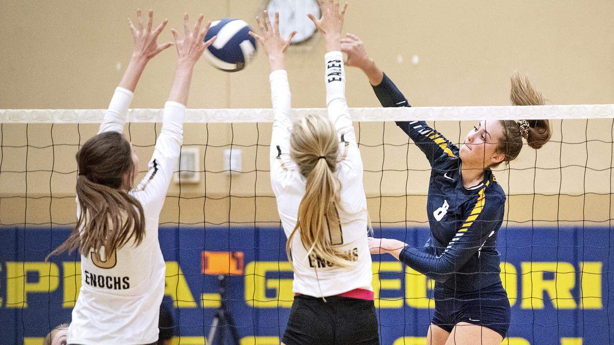 Gregori’s Olivia Keller hits a kill shot past Enochs defenders Riley Geary (1) and Sorelle Cherry (5) during the Central California Athletic League game at Gregori High School in Salida, Calif., Wednesday, Sept. 25, 2019. Gregori won the match 3-0.