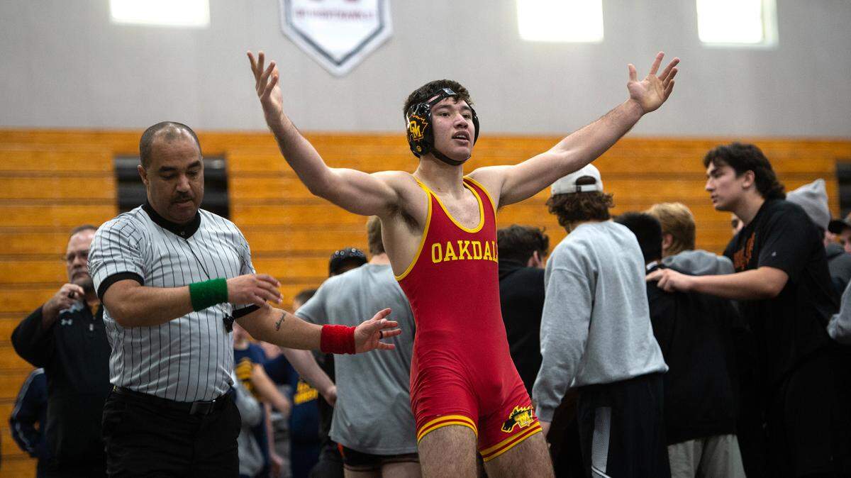 160-pound Carlos Garcia of Oakdale reacts after his victory over Vacaville’s Arjun Nagra during the CIF Sac-Joaquin Section Wresting Team Duals Championships at Natomas High School in Sacramento, Calif., on Saturday, Jan. 29, 2022. Vacaville won the DI championship 41-19.