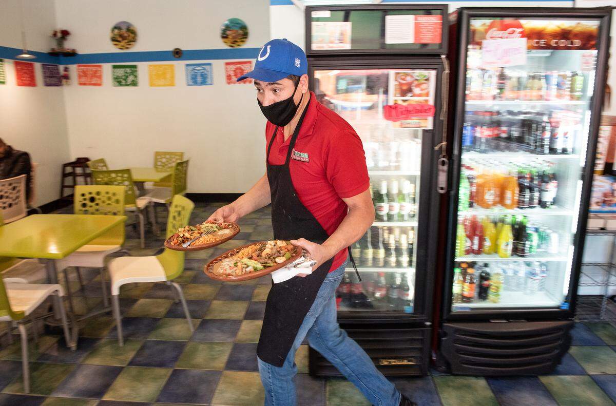 Owner Luis Cardenas is now serving food on ceramic plates inside at Taqueria Cardenas in Modesto, Calif., on Wednesday, March 24, 2021.