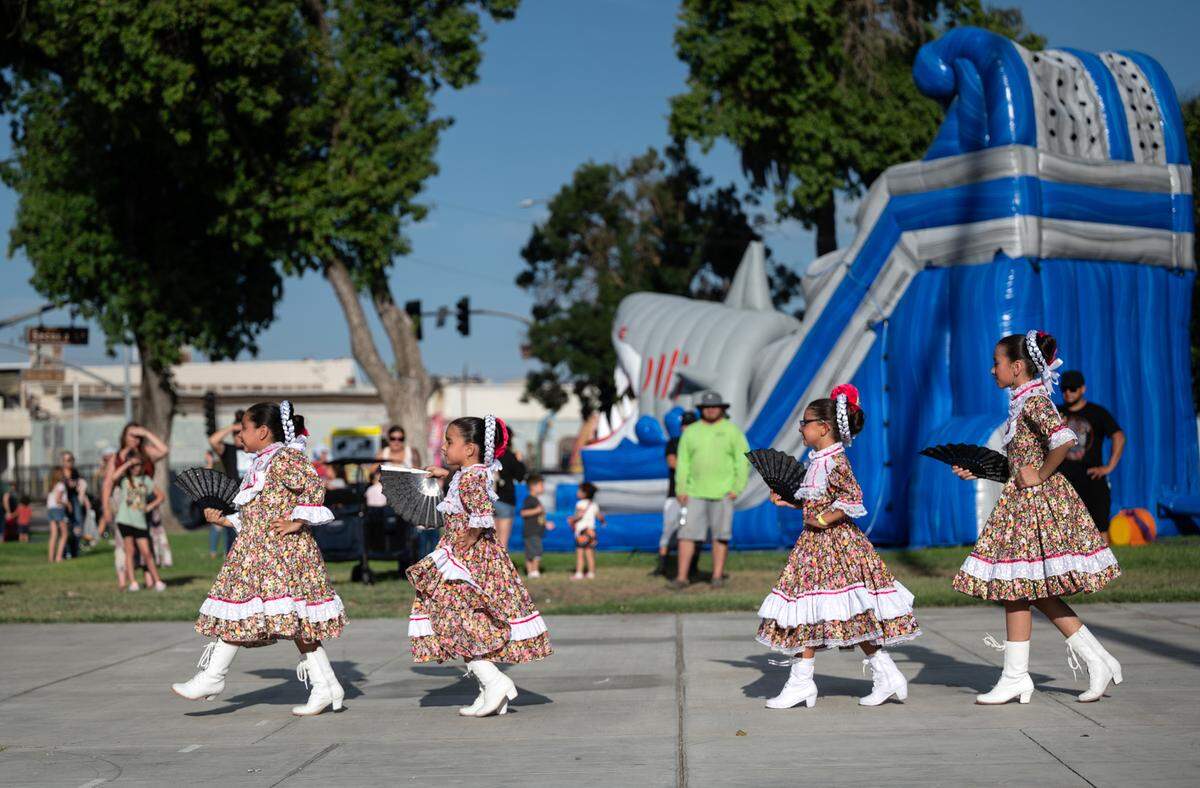 Girls from Westside Fiesta Mexicana Alas dance group perform during National Night Out at North Park in Patterson, Calif., Tuesday, Aug. 1, 2023.