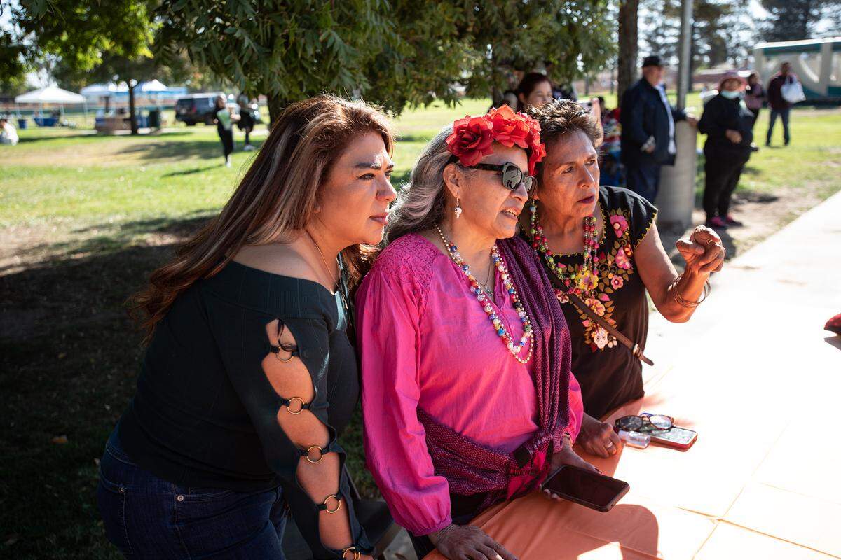 From the left, Cynthia Ruiz, Alina Arzola and Laura Malagon judge the Catrina contest during the Dia de los Muertos celebration at Fairview Park in Modesto, Calif., Saturday, Oct. 29, 2022.