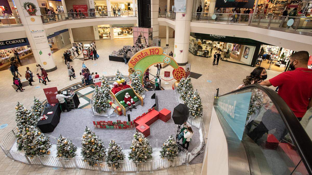 People shop at Vintage Faire Mall in Modesto, Calif., on Friday, Nov. 27, 2020.