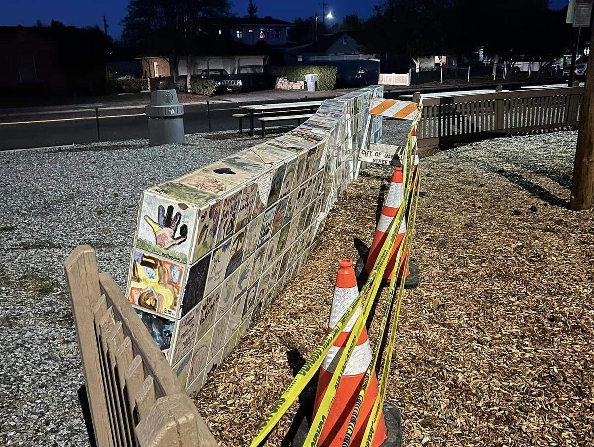 The aftermath of a collision that happened during a police pursuit near Dorada Park in Oakdale on Sunday, Nov. 24, 2024. A white pickup truck damaged a tiled wall with school children’s art. The wall of was of historic significance, according to the City of Oakdale.