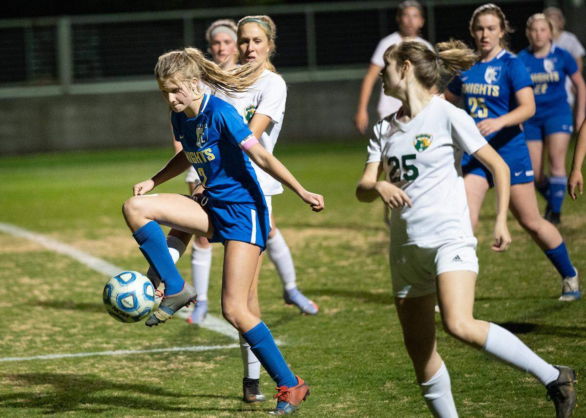 Ripon Christian’s Annalies Vander Meulen, left, controls the ball during the Division VI playoff game with Mariposa County at Ripon Christian High School in Ripon, Calif., on Wednesday, Feb. 16, 2022. Mariposa County won the game 3-2.