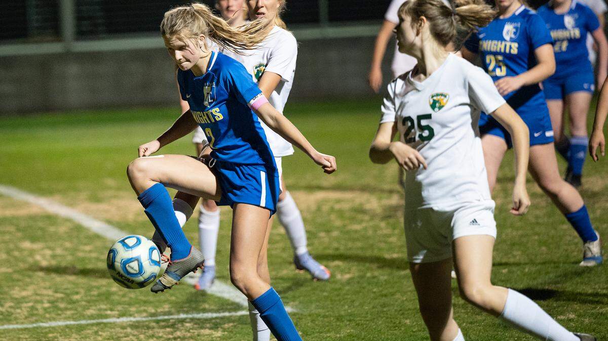 Ripon Christian’s Annalies Vander Meulen, left, controls the ball during the Division VI playoff game with Mariposa County at Ripon Christian High School in Ripon, Calif., on Wednesday, Feb. 16, 2022. Mariposa County won the game 3-2.