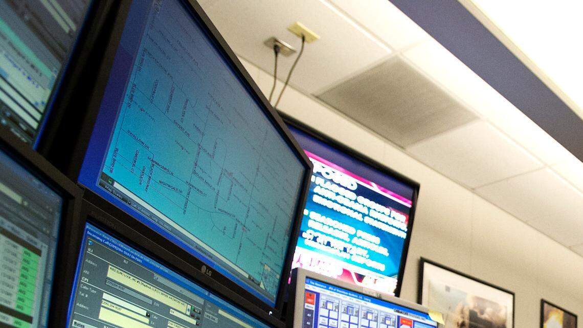 Stanislaus Regional 911 Dispatch Manager Cathy McFadon takes calls at the dispatch office in Modesto, Wednesday September 18, 2013
