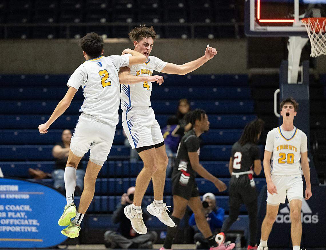 Ripon Christian’s Luke Crivello (2) and Amos Cady celebrate after Crivello drained a three-point basket before half in the Sac-Joaquin Section Division V championship game at UC Davis in Davis, Calif., Friday, Feb. 23, 2024.