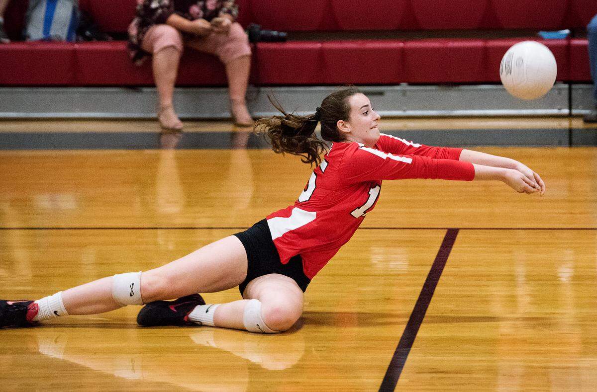 Modesto’s Hannah Scott digs the ball during the Sac Joaquin Section playoff game with Folsom at Modesto high School in Modesto, Ca., on Tuesday, Oct. 23, 2018.