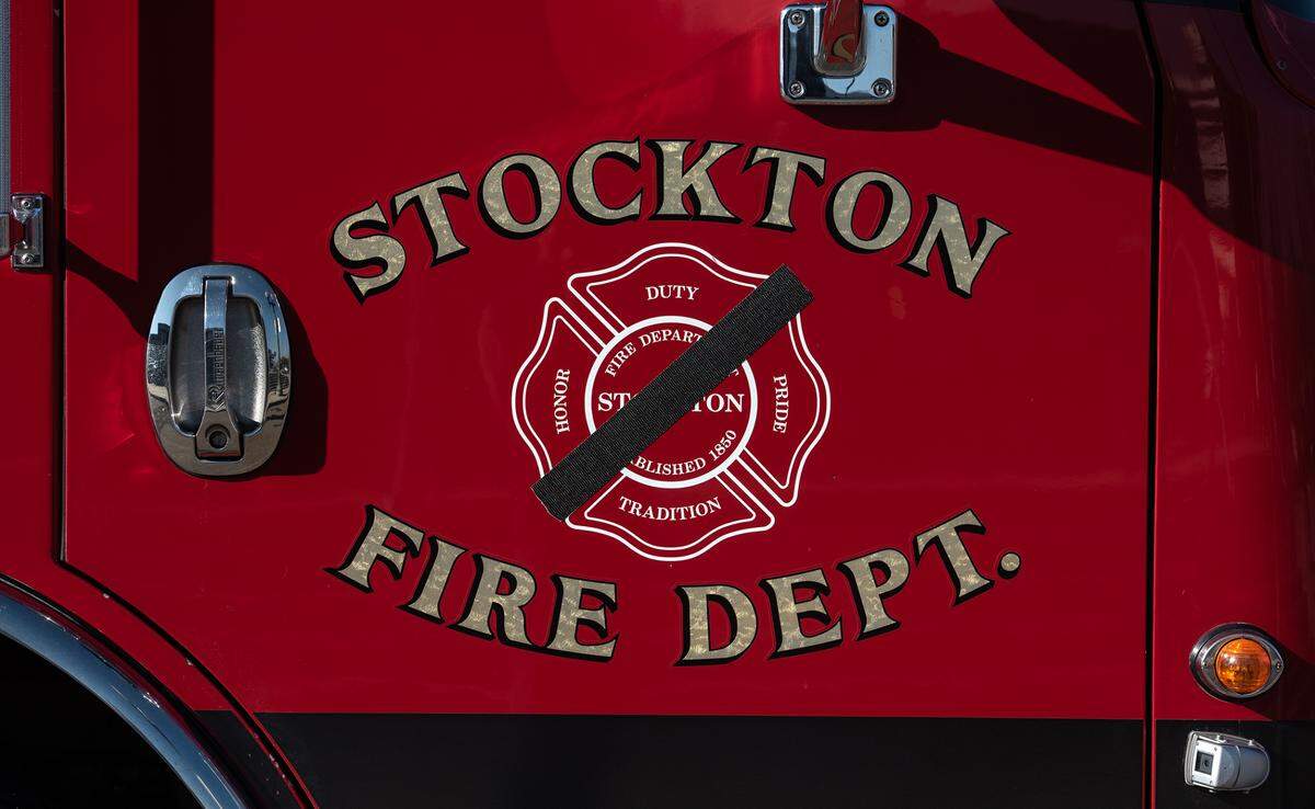 One of many fire trucks outside the memorial service for fallen Stockton Fire Capt. Vidal “Max” Fortuna at the Banner Island Ballpark in Stockton, Calif., on Tuesday, Feb. 8, 2022.