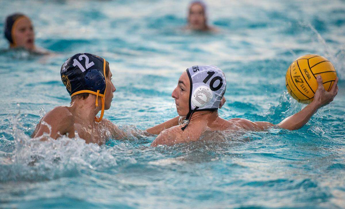 Enochs’ Jake Peeler looks to take a shot as Turlock’s Sam Stempson defends during a Central California Athletic League match at Turlock High School in Turlock, Calif., on Tuesday, Oct. 12, 2021. Turlock won 20-3.