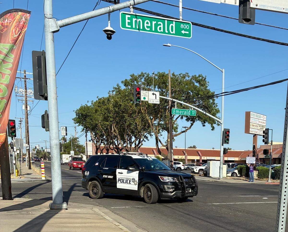A police SUV rounds the corner where the Republican fundraiser is being held. 