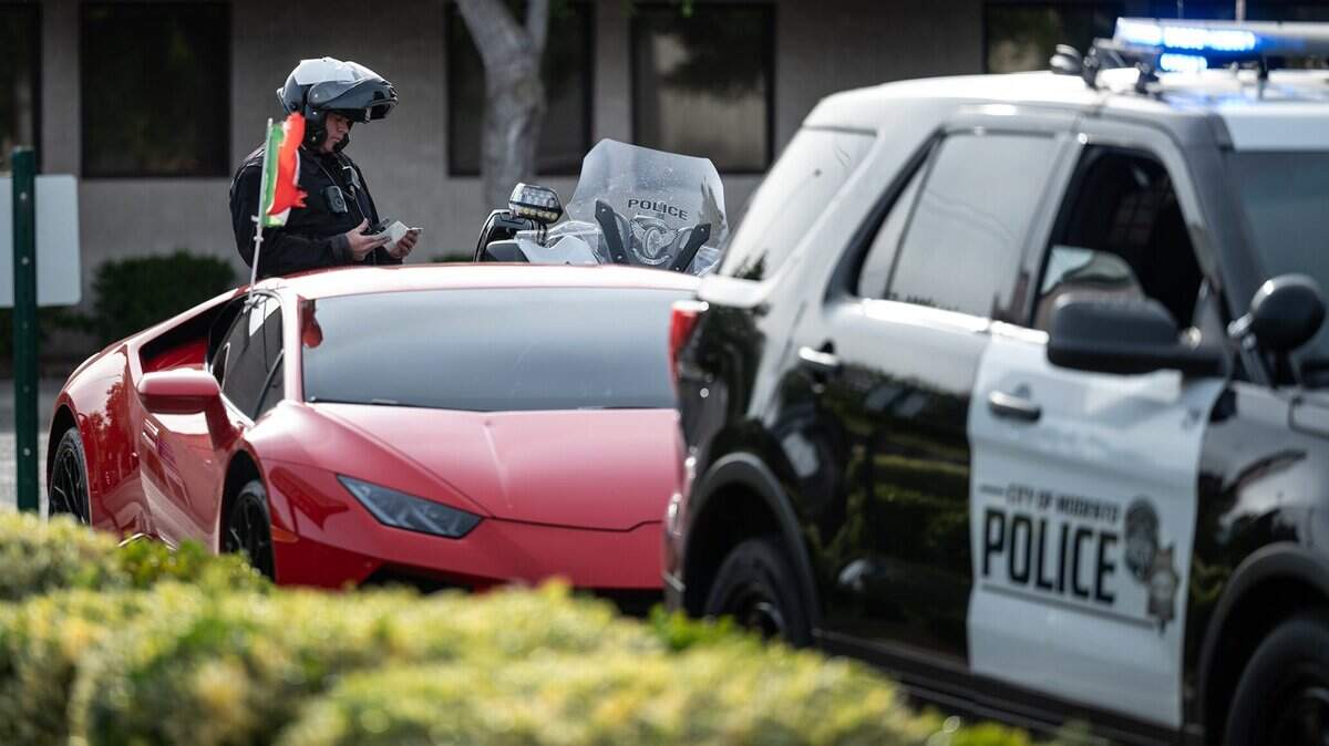 A Modesto police officer cites a driver on McHenry Avenue in May 2022.