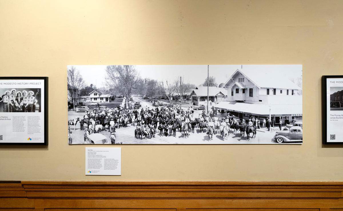 1939 panoramic photograph of the Shiloh Rodeo Parade at the intersection of Needham and Virginia Streets in Modesto, pictured as part of the Modesto History project exhibit at the McHenry Museum in Modesto, Calif., Friday, Feb. 16, 2024.
