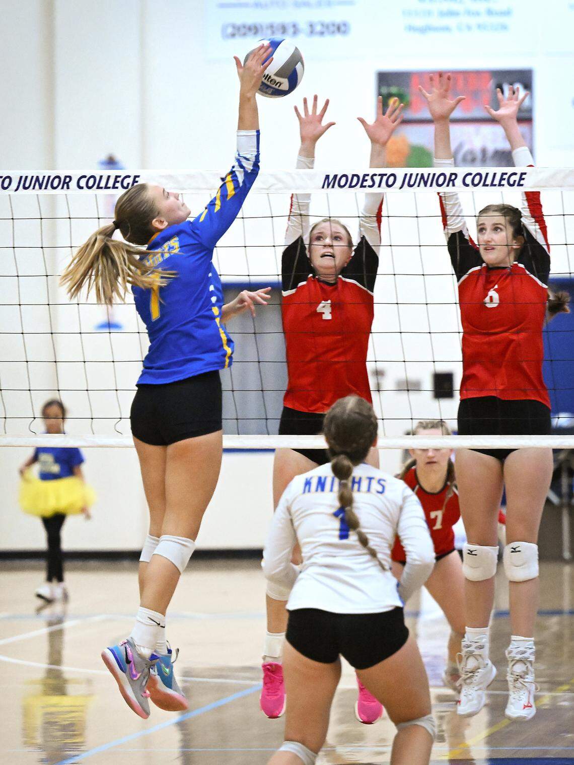 Ripon Christian’s Jordan Vander Veen spikes the ball as Ripon’s Katelyn Bogetti (4) and Olivia Neuman (6) defend during the Sac-Joaquin Section Division IV championship match at Modesto Junior College in Modesto, Calif., Saturday, Nov. 4, 2023. Ripon Christian won the match 3-0.