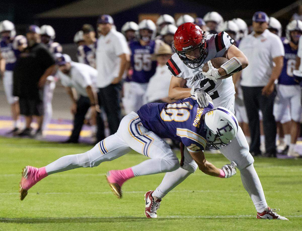 Escalon’s Chase Cummings tackles Woodland Christian’s Jace Moore during a non-league game against Woodland Christian at Escalon High School on Thursday, Oct. 10, 2024.