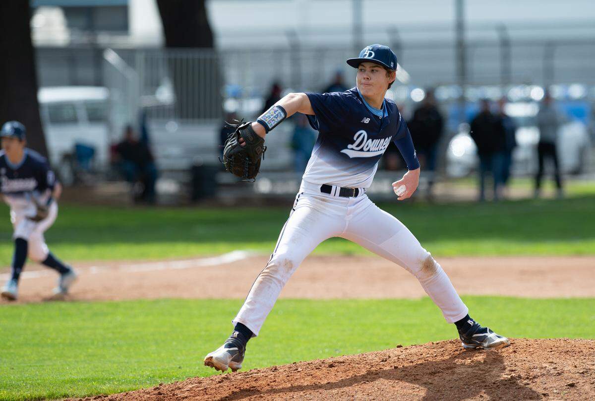 Downey’s Isaac Doornewaard delivers a pitch during the Central California Athletic league game with Turlock at Downey High School in Modesto, Calif., Thursday, March 23, 2023.