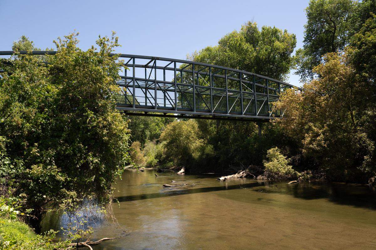 A pedestrian bridge over the Stanislaus River at Mavis Stouffer Park in Ripon , Friday July 18, 2025.