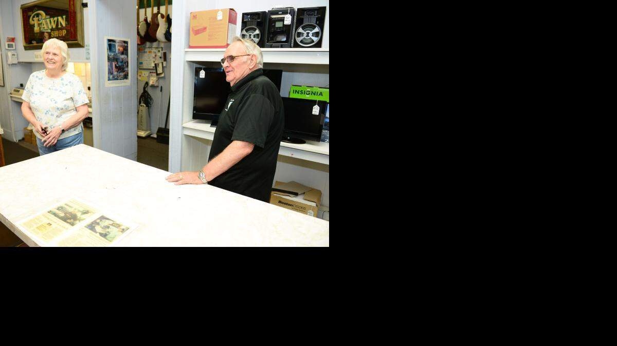 Mary and Wayne Gose, owners of The Pawn Shop in Atwater, talk in their store Aug. 15, 2014. They were hit with an ADA lawsuit for not having proper handicapped-accessible signage in their parking lot.
