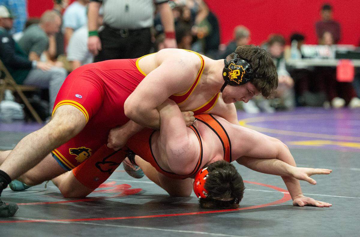 Oakdale’s Emilio Johnson wrestles Vacaville’s Jai Guerra during the D1 Sac-Joaquin Section team duals wrestling championship at Lincoln High School in Stockton, Calif., Saturday, Jan. 28, 2023.
