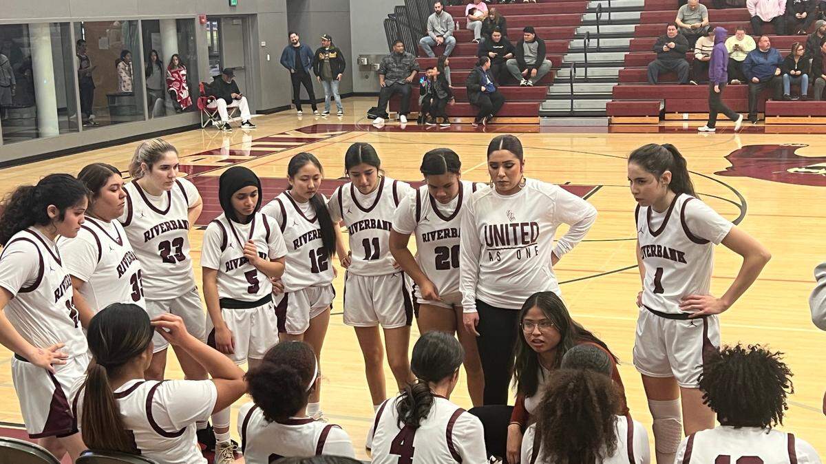 Riverbank Janelle Luu talks with her team during a timeout during the Sac-Joaquin Section Division IV quarterfinals against Liberty Ranch on Thursday, Feb. 16 in Riverbank, Calif. The Bruins won 56-40.