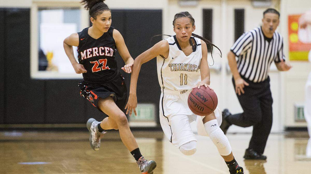 Buhach Colony sophomore Nia Smiley (11) dribbles up the court during a game against Merced at Buhach Colony High School in Atwater, Calif., on Thursday, Jan. 5, 2017. The Bears beat the Thunder 54-47. Smiley has transferred to and is eligible to play for Modesto Christian.