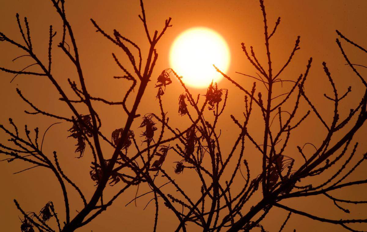 Smoke clouds over the sun in Modesto on Wednesday August 19, 2020.