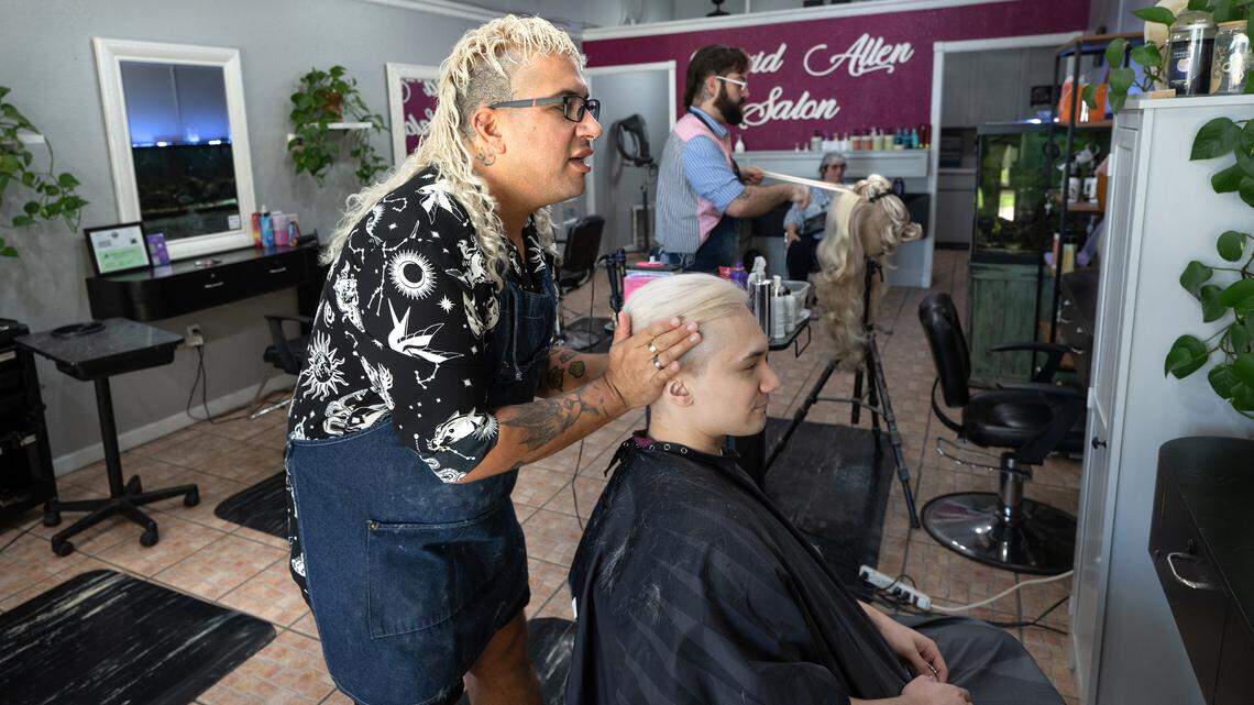 David Soria styles the hair of Vince Calderon at the David Allen Salon in Oakdale, Calif., Tuesday, Aug. 20, 2024.
