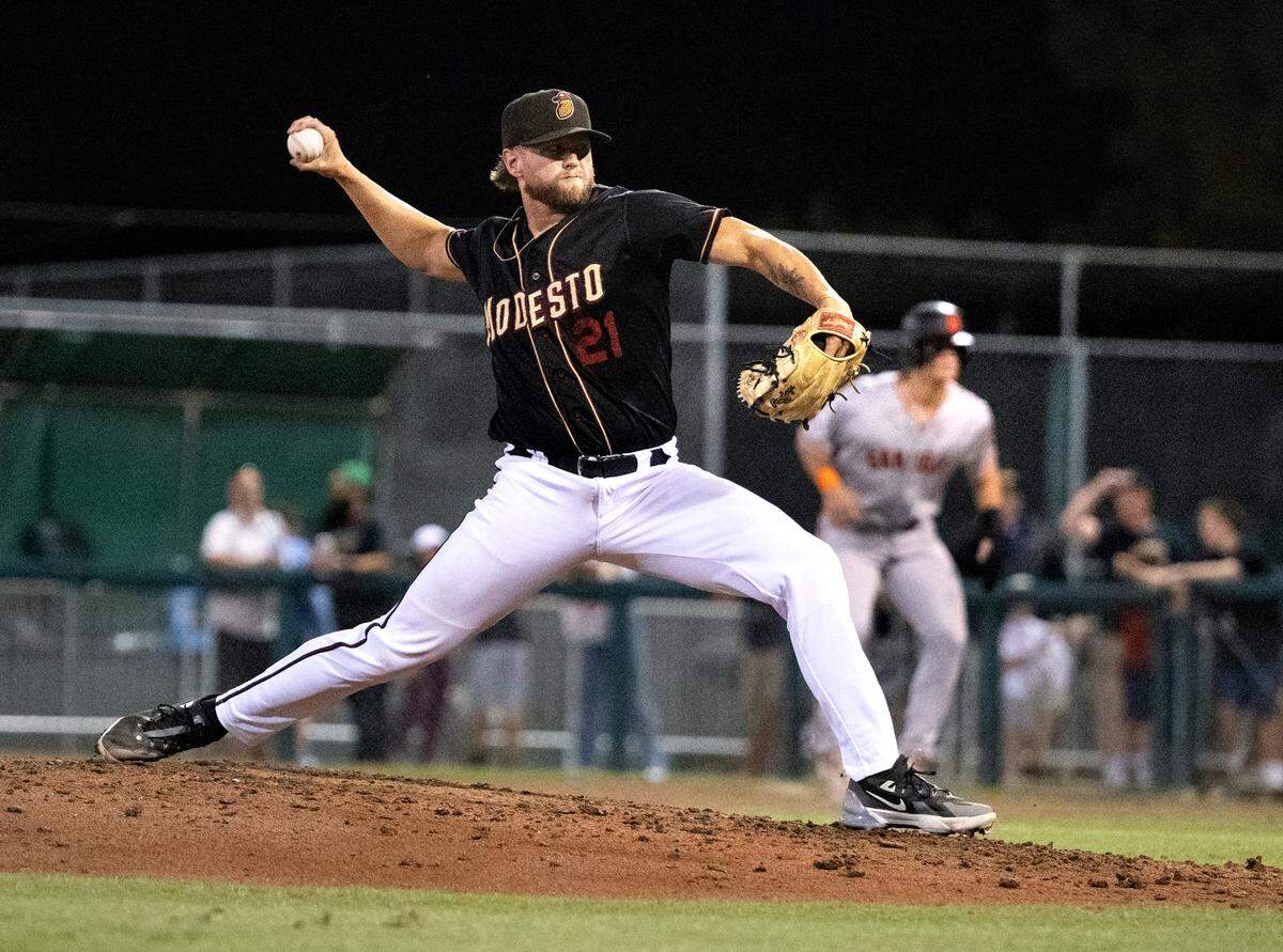 Modesto Nuts’ Jesse Wainscott delivers a pitch in the California League North Division series with the San Jose Giants at John Thurman Field in Modesto, Calif., Thursday, Sept. 12, 2024.