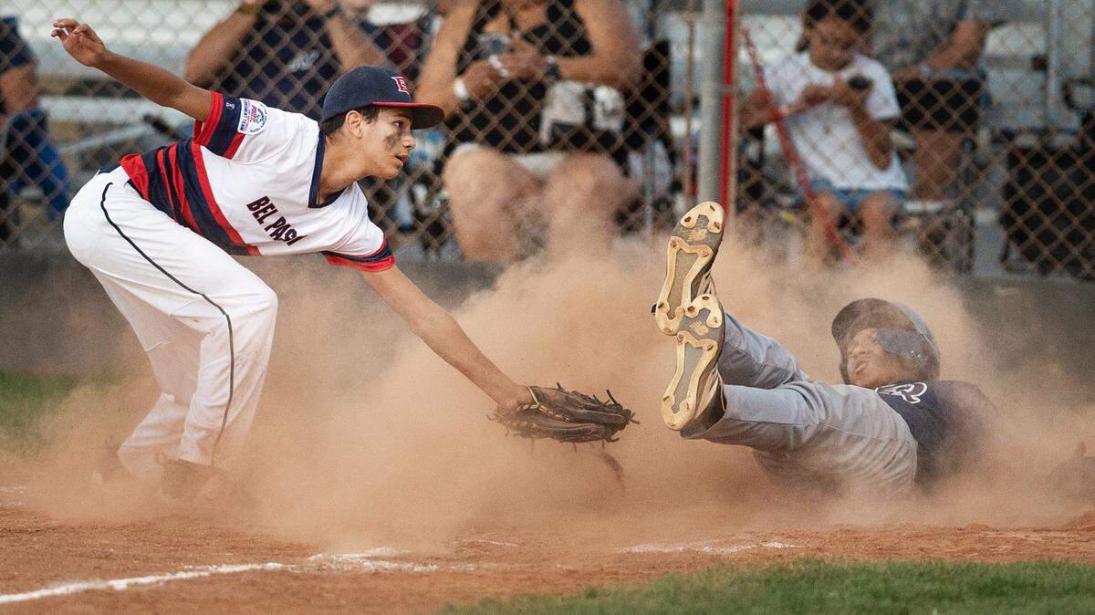 Bel Passi pitcher Isaiah Hernandez tags out a La Quinta runner during the Pony-13 World Series at Bel Passi baseball complex in Modesto, Calif., on Friday, July 23, 2021.