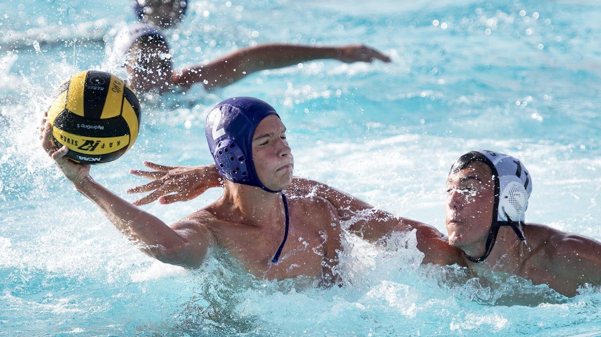 Johansen’s Shelby Johnson (left) scores a goal as Enochs’ Dylan Lahti defends during the Modesto Metro Conference match at Johansen High School in Modesto, Calif., on Tuesday, September 20, 2016.