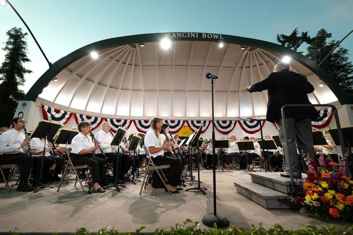 Conductor George Gardner leads MoBand during a 2023 concert at Mancini Bowl in Graceada Park.