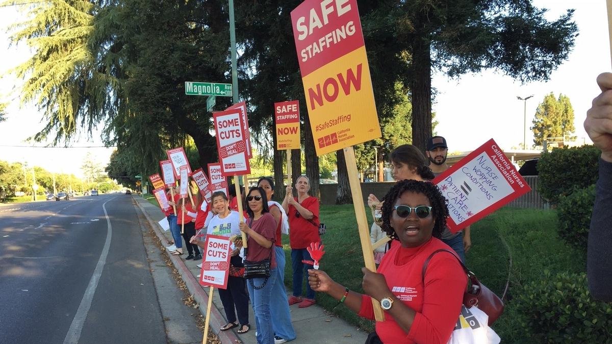 Nurses protest staffing policies Tuesday morning outside Doctors Medical Center in Modesto.