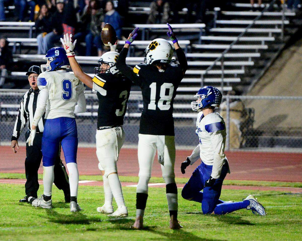 Hughson running back Lawson Aviles (3) signals for a touchdown after scoring during a 2024 CIF Sac-Joaquin Section Division V Playoff game between Hughson High School and El Dorado High School at Hughson High School in Hughson California on November 15, 2024. Hughson won the game 28-6.