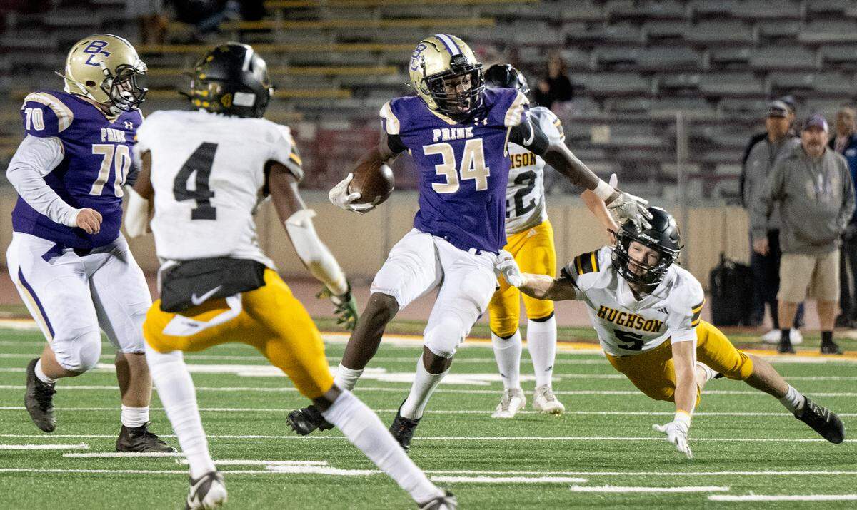 Bradshaw Christian’s Devyn McDonald runs past Hughson’s Larkin Meyer after a catch during the Sac-Joaquin Section Division VI championship game at Sacramento City College in Sacramento, Calif., Saturday, Nov. 25, 2023.