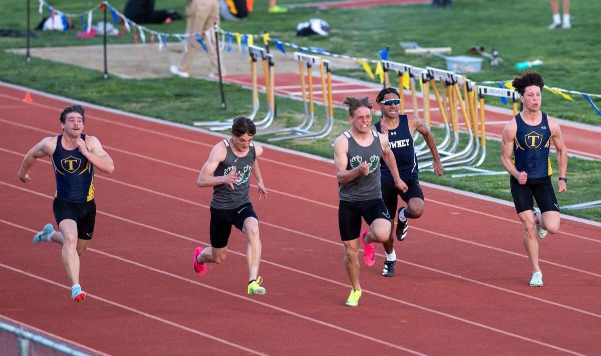 Pitman’s Joey Stout won the 100 meter dash with a time of 11.23 in the Stanislaus County track meet at Hughson High School in Hughson, Calif., Friday, March 24, 2023. Runners from the left, Turlock’s Peter Mello, placed third at 11.63, Pitman’s Blayne Siebert finished second at 11.24, Stout, fourth place Downey’s Rusty Jones 11.65, and Turlock’s Steven Salazar at 11.66 for fifth place.