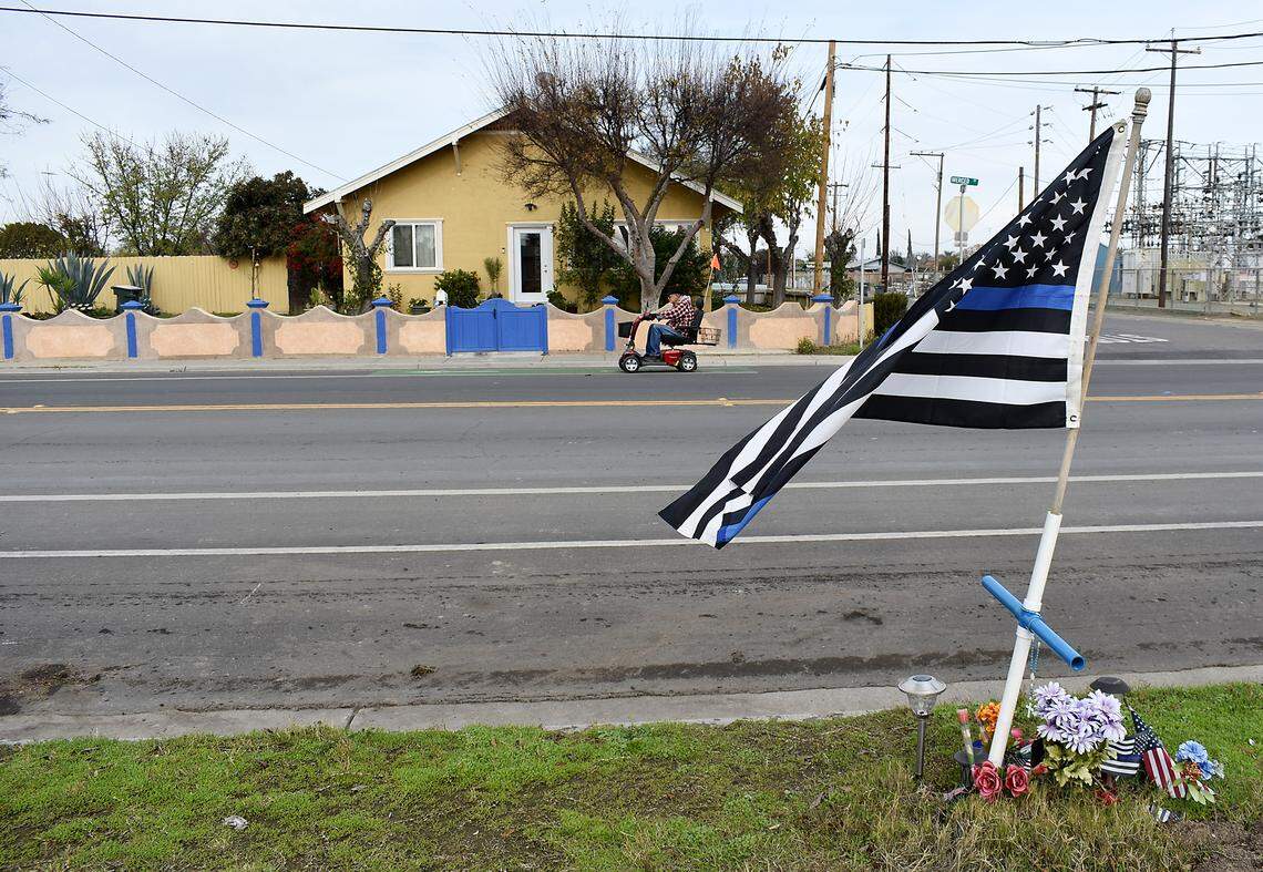 At the intersection of Merced Street and Eucalyptus Avenue in Newman, where Cpl. Ronil Singh was killed Dec. 26, 2018, a memorial stands on one side of the street, while on the other, a family added blue accents to a wall in honor of the police officer. Photographed Tuesday, Dec. 17, 2019.