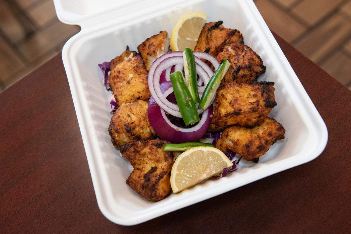 Take-out order of Basa fish tika at Tandoori Masala in Modesto, Calif., Thursday, Dec. 8, 2022.