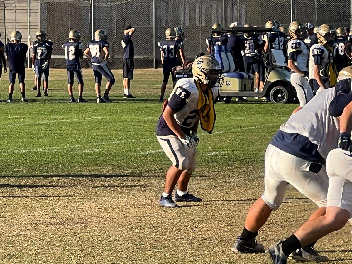 Central Catholic’s Benny Padilla practices against the starters with a yellow mesh jersey to show he is on defense.